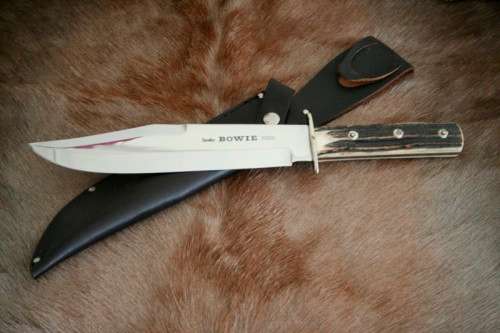 A superb original handmade German Solingen Inox Linder Bowie knife in its embossed leather scabbard
