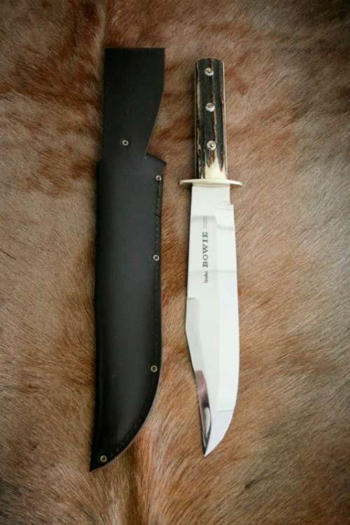 A superb original handmade German Solingen Inox Linder Bowie knife in its embossed leather scabbard