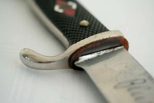 An extremely rare WWII German (early issue) "Hitler Youth" Blut und Ehre knife and scabbard