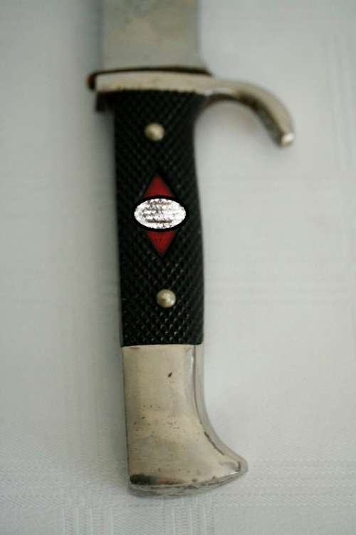 An extremely rare WWII German (early issue) "Hitler Youth" Blut und Ehre knife and scabbard