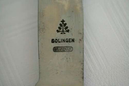 An extremely rare WWII German (early issue) "Hitler Youth" Blut und Ehre knife and scabbard