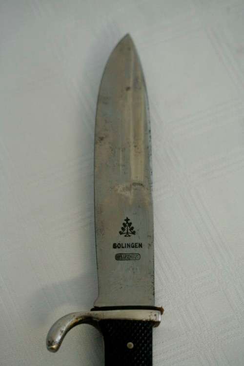 An extremely rare WWII German (early issue) "Hitler Youth" Blut und Ehre knife and scabbard