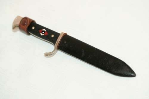 An extremely rare WWII German (early issue) "Hitler Youth" Blut und Ehre knife and scabbard