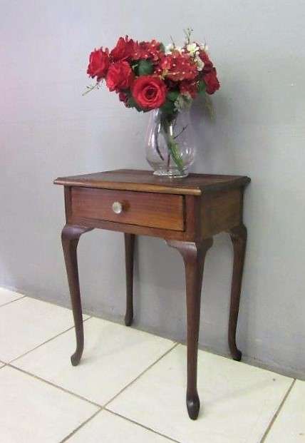 A very stylish imbuia bedside table with amazing Queen Anne legs and a centre drawer - stunning!!