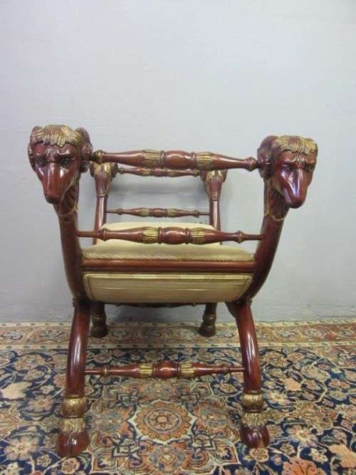 Two incredible rare vintage Empire parcel gilt curule chairs w/ ram's-head detailing - price/ chair