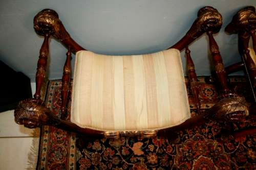 Two incredible rare vintage Empire parcel gilt curule chairs w/ ram's-head detailing - price/ chair
