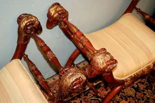 Two incredible rare vintage Empire parcel gilt curule chairs w/ ram's-head detailing - price/ chair