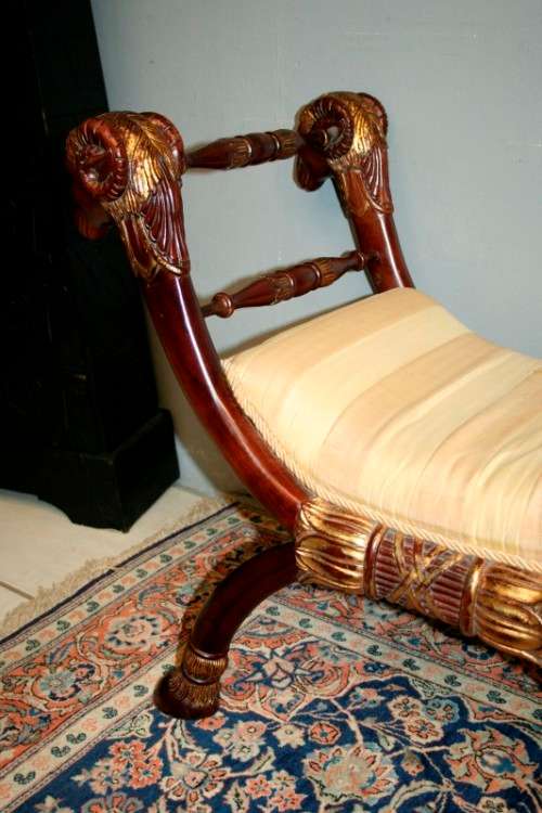 Two incredible rare vintage Empire parcel gilt curule chairs w/ ram's-head detailing - price/ chair