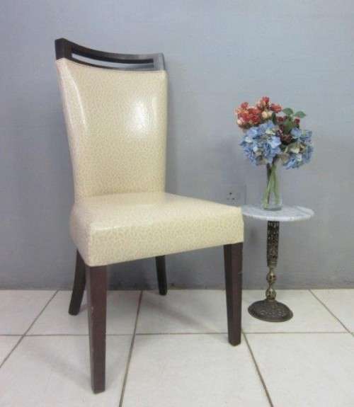 A stunning and extremely stylish high-back occasional chair in a superb patent-leather feel fabric