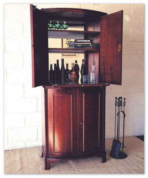 A stunning & stylish (tall) drinks cabinet with a fold-down serving shelf and loads of storage space
