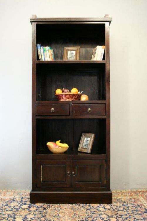 A wonderful tall teak display cabinet/ bookcase with shelves, storage cupboards and drawers