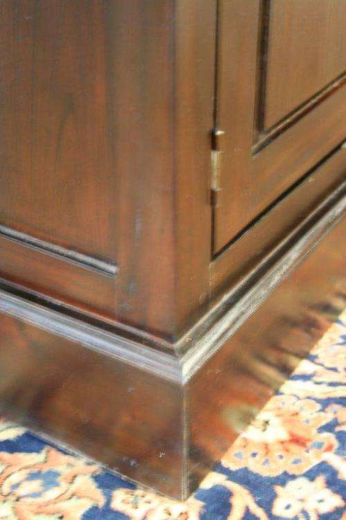 A wonderful tall teak display cabinet/ bookcase with shelves, storage cupboards and drawers