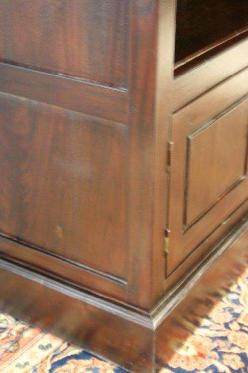A wonderful tall teak display cabinet/ bookcase with shelves, storage cupboards and drawers