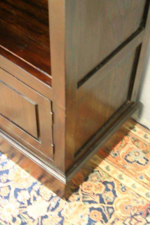 A wonderful tall teak display cabinet/ bookcase with shelves, storage cupboards and drawers