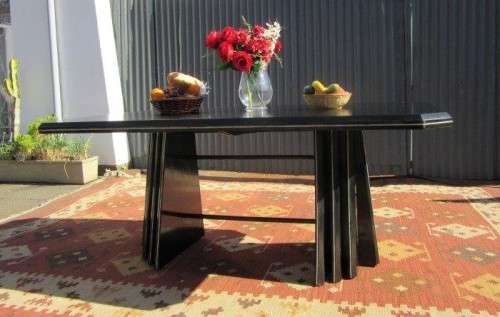 A stunning large retro 8-seater dining table in a gloss black & finished with gold trim - RS17Sale