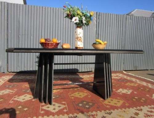 A stunning large retro 8-seater dining table in a gloss black & finished with gold trim - RS17Sale