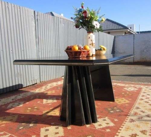 A stunning large retro 8-seater dining table in a gloss black & finished with gold trim - RS17Sale