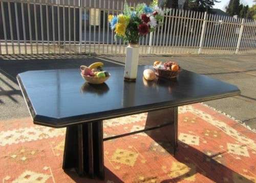 A stunning large retro 8-seater dining table in a gloss black & finished with gold trim - RS17Sale
