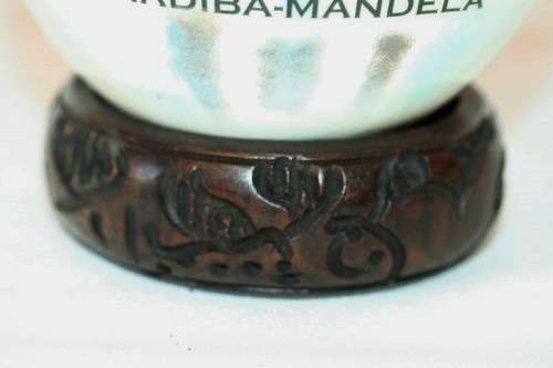 A superb and stunningly made "Nelson Mandela - Madiba" genuine ostrich egg on a carved stand