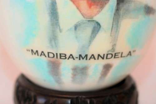 A superb and stunningly made "Nelson Mandela - Madiba" genuine ostrich egg on a carved stand