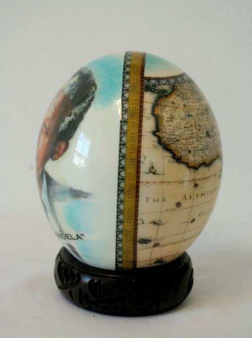 A superb and stunningly made "Nelson Mandela - Madiba" genuine ostrich egg on a carved stand