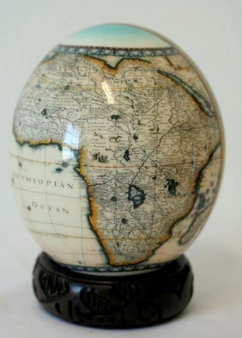 A superb and stunningly made "Nelson Mandela - Madiba" genuine ostrich egg on a carved stand