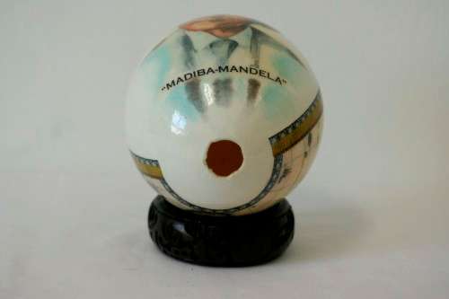 A superb and stunningly made "Nelson Mandela - Madiba" genuine ostrich egg on a carved stand