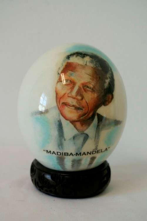 A superb and stunningly made "Nelson Mandela - Madiba" genuine ostrich egg on a carved stand