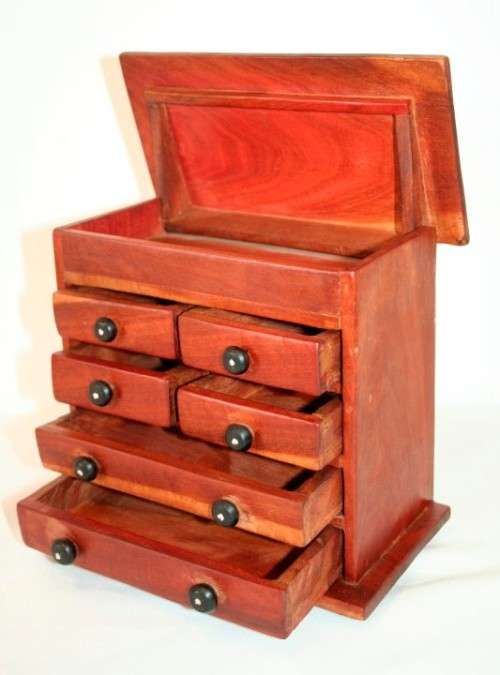 An awesome hand made solid teak jewellery box with six drawers and a storage tray under the lid