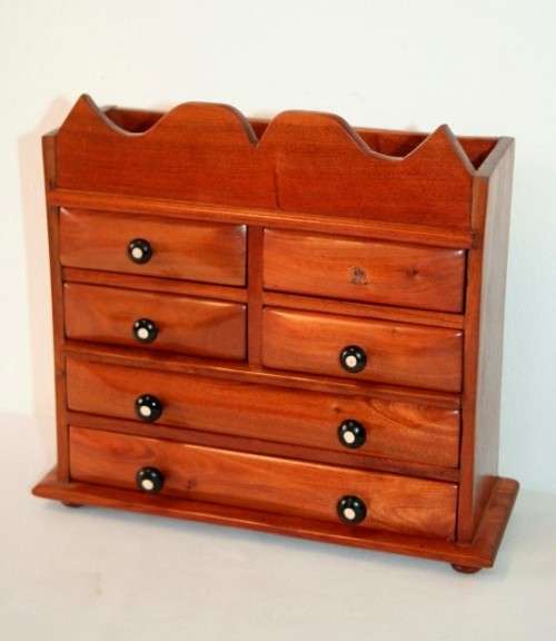 A gorgeous hand made solid teak jewellery box with six drawers and a storage section on top