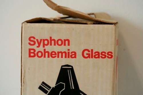 An incredible gold-mesh soda syphon spritzer in its original box in superb condition - never used
