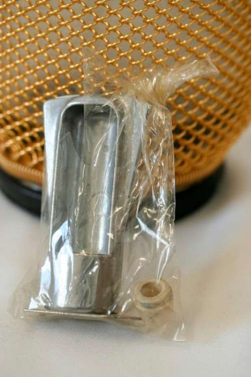 An incredible gold-mesh soda syphon spritzer in its original box in superb condition - never used