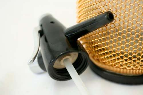 An incredible gold-mesh soda syphon spritzer in its original box in superb condition - never used