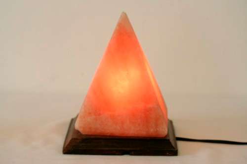 An incredible "Pyramid" Himalayan Crystal Salt lamp on a wooden base in complete working condition
