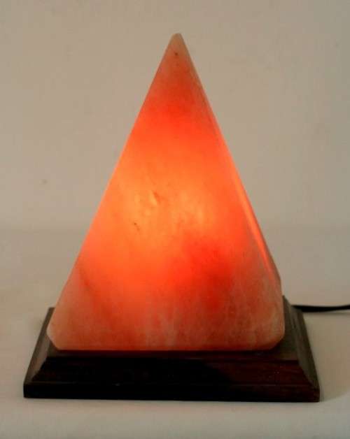 An incredible "Pyramid" Himalayan Crystal Salt lamp on a wooden base in complete working condition