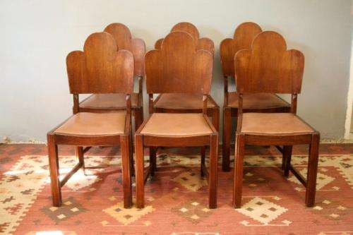An awesome vintage 6-seater dining room suite w/ a solid table and six upholstered dining chairs