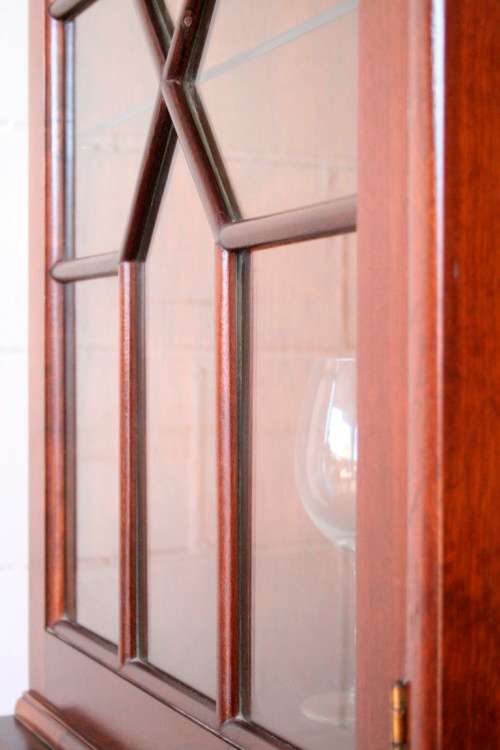 A beautiful vintage Imbuia ball and claw double door show-cabinet with two drawers & glass shelf.