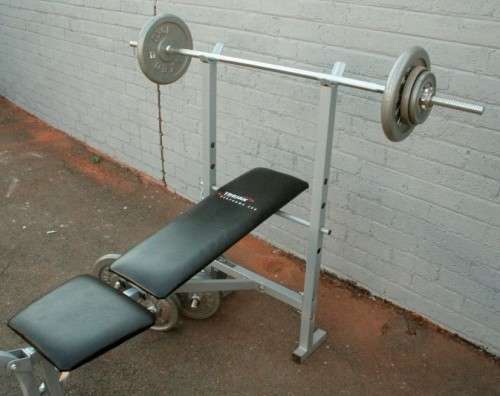 A fantastic original Trojan Performa 300 bench assorted weights in awesome condition