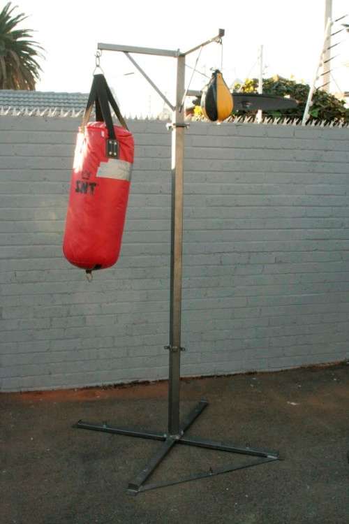 A well made steel boxing stand with a "SNT" punching bag and an "Everlast" speed bag = for home use!