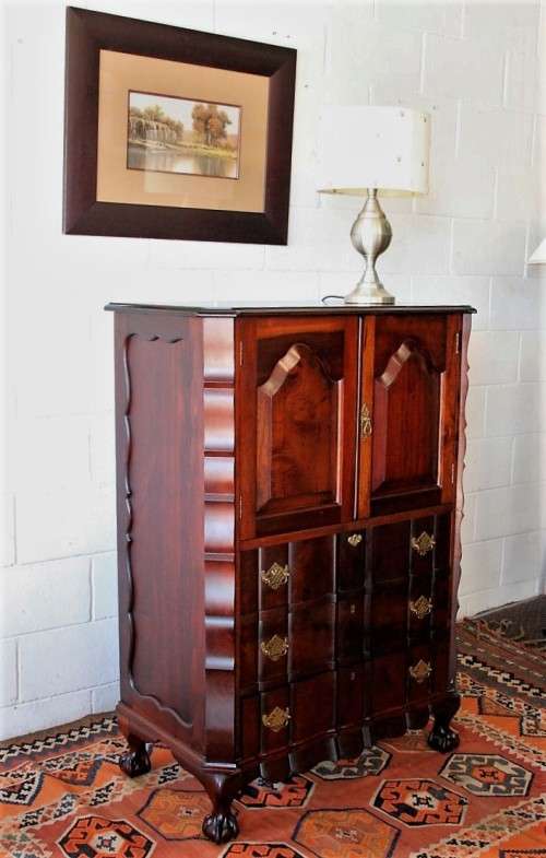A beautiful vintage ball and claw "Tallboy" multi-purpose cabinet with 3 drawers and scalloped edges