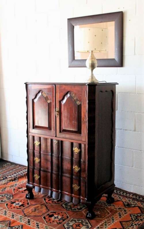 A beautiful vintage ball and claw "Tallboy" multi-purpose cabinet with 3 drawers and scalloped edges