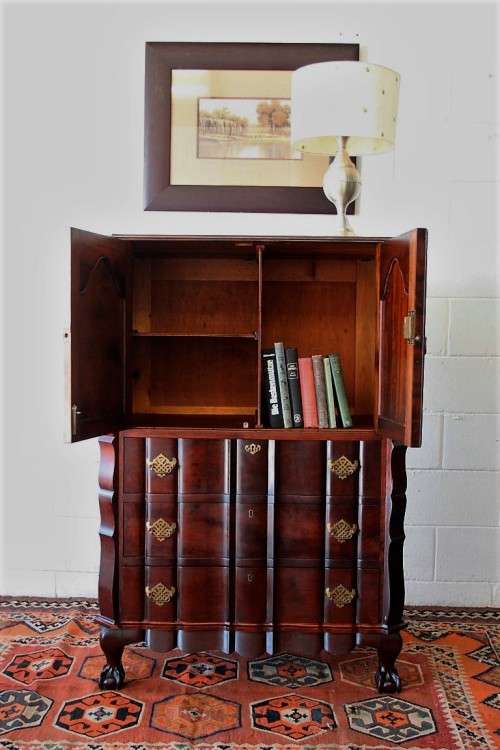 A beautiful vintage ball and claw "Tallboy" multi-purpose cabinet with 3 drawers and scalloped edges