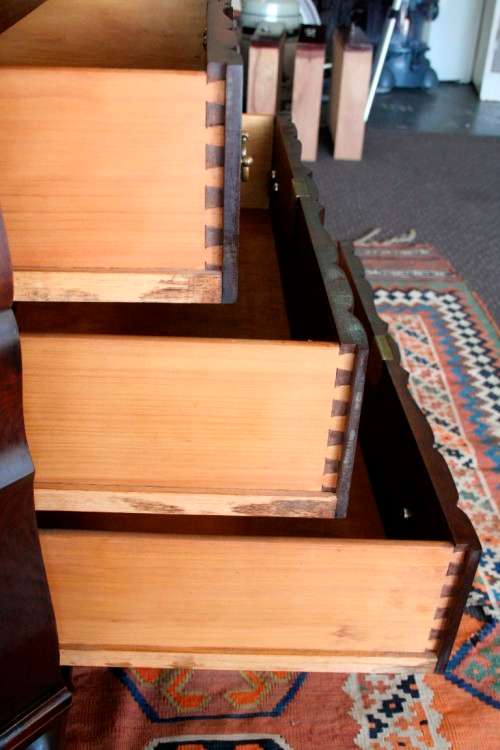 A beautiful vintage ball and claw "Tallboy" multi-purpose cabinet with 3 drawers and scalloped edges