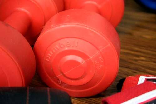 An incredible collection of gym exercise equipment including gloves, a skipping rope, weighs & more