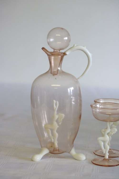 A spectacular antique Art Deco Bimini & Lauscha lampwork decanter set with milk glass "nude" stems