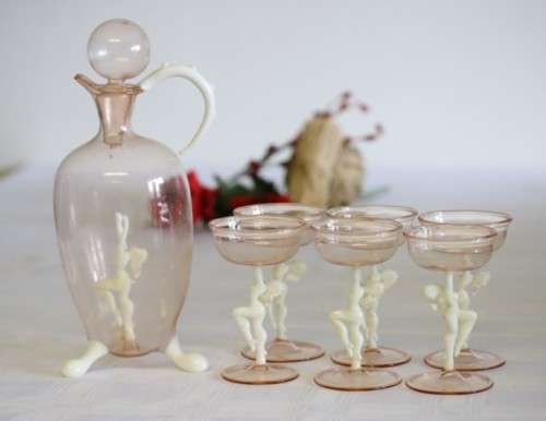 A spectacular antique Art Deco Bimini & Lauscha lampwork decanter set with milk glass "nude" stems