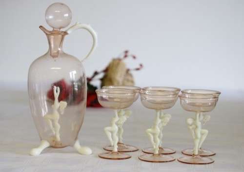 A spectacular antique Art Deco Bimini & Lauscha lampwork decanter set with milk glass "nude" stems