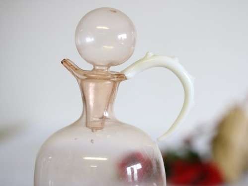 A spectacular antique Art Deco Bimini & Lauscha lampwork decanter set with milk glass "nude" stems