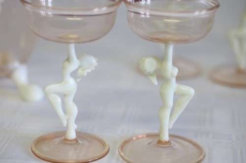 A spectacular antique Art Deco Bimini & Lauscha lampwork decanter set with milk glass "nude" stems