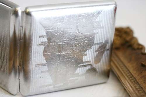 An awesome vintage "Retro" chrome plated cigarette holder with the map of Southern Africa pre 1975